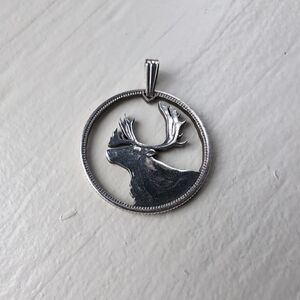 Silver Canadian caribou cut quarter pendant